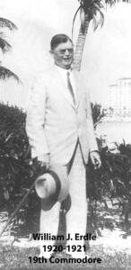 Black‑and‑white portrait of a yacht club commodore wearing a formal jacket and commodore’s cap