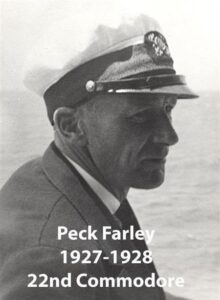 Black‑and‑white portrait of a yacht club commodore wearing a suit and cap
