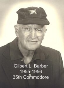 Portrait of a man in a yacht club commodore uniform with a white cap and dark jacket
