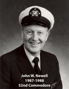 Portrait of a man in a yacht club commodore uniform with a white cap and dark jacket