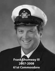 Portrait of a man in a yacht club commodore uniform with a white cap and dark jacket